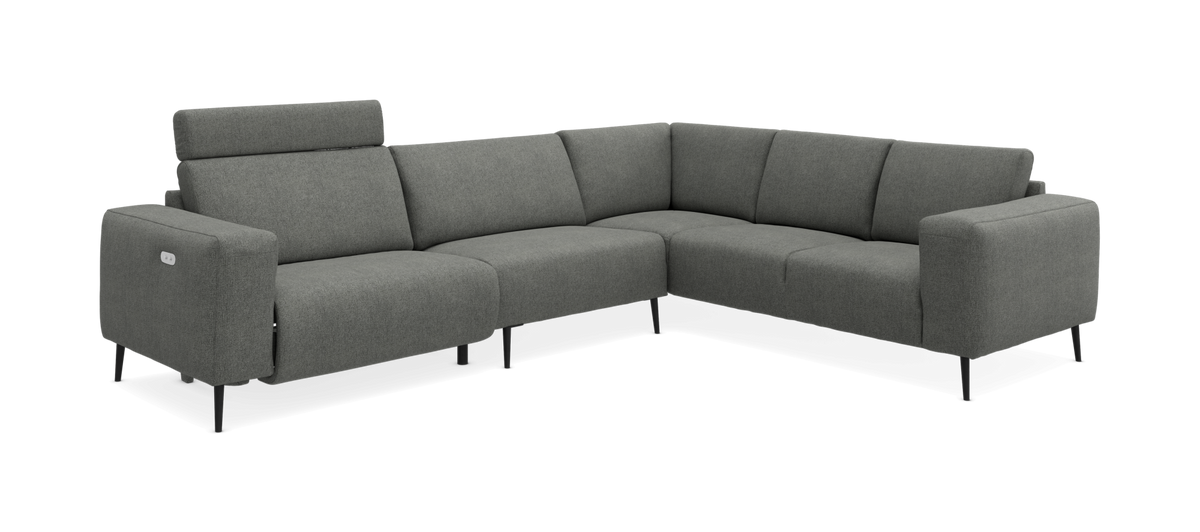 Grå L-formet hjørnesofa med slanke metalben og justerbar nakkestøtte, fritlagt på neutral baggrund.