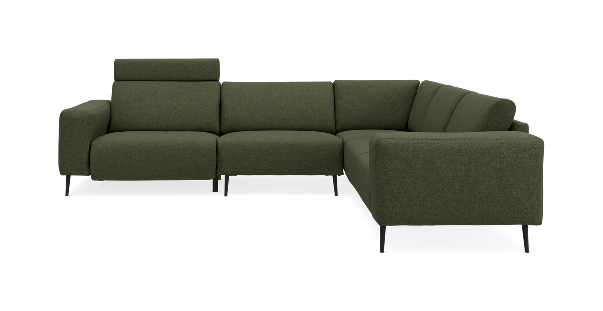 Grøn L-formet modulsofa med højre chaiselong og justerbar nakkestøtte, fotograferet lige for i studie.