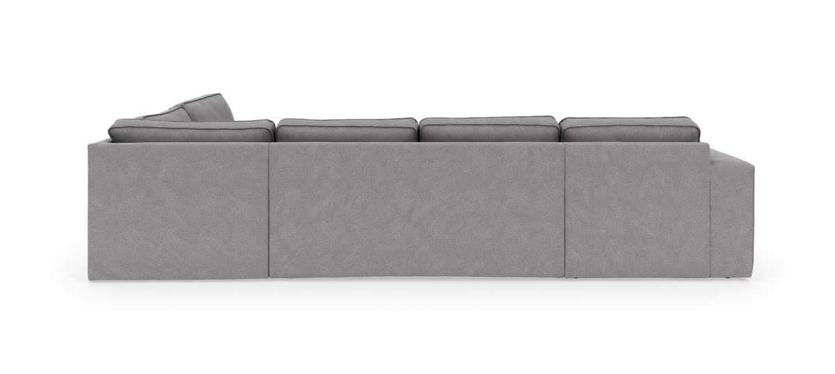 Grå modulsofa set bagfra med højre hjørnesektion på neutral studiebaggrund.