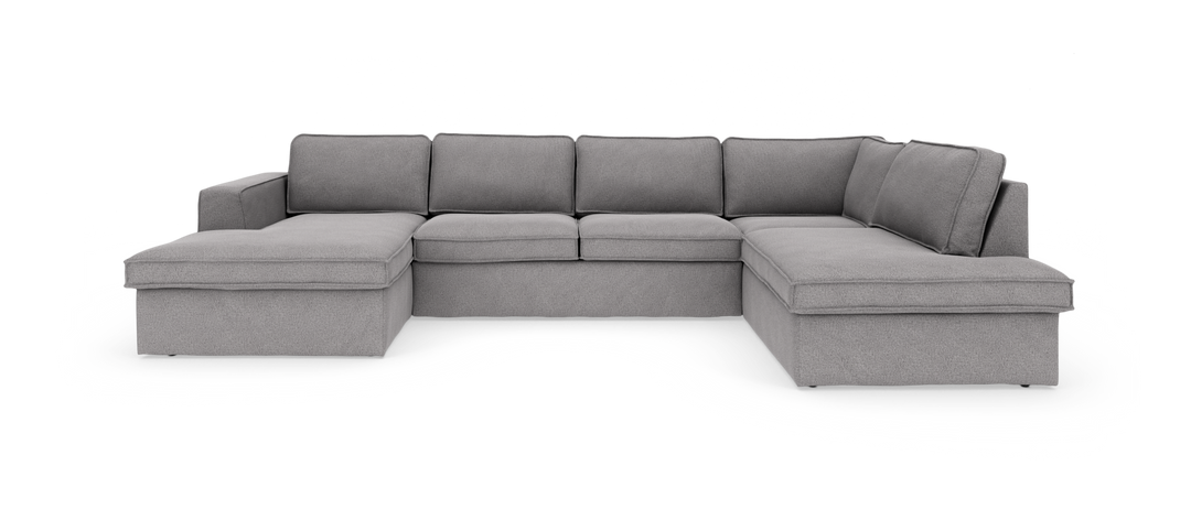 Grå U‑formet modulsofa med chaiselong i begge ender, frilagt på hvid baggrund.