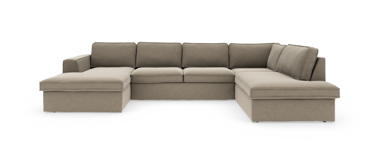 Beige U‑formet modulsofa med chaiselong i begge ender, frilagt på hvid baggrund.