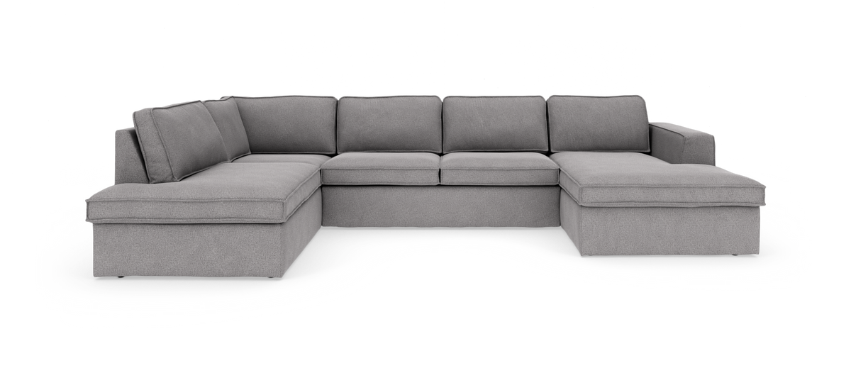 Grå U‑formet modulsofa med chaiselong i begge sider, frilagt på hvid baggrund.
