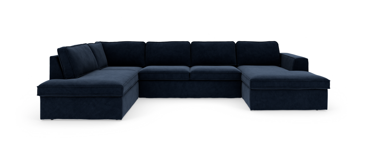 Stor U-formet modulsofa i mørkeblåt stof med chaiselonger i begge ender, frilagt på hvid baggrund.