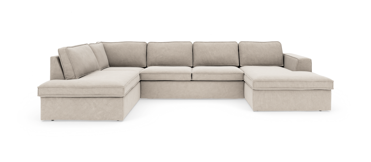 Beige U-sofa i fløjl/cord med dobbelt chaiselong, kraftige sæde- og ryghynder, frilagt på hvid baggrund.