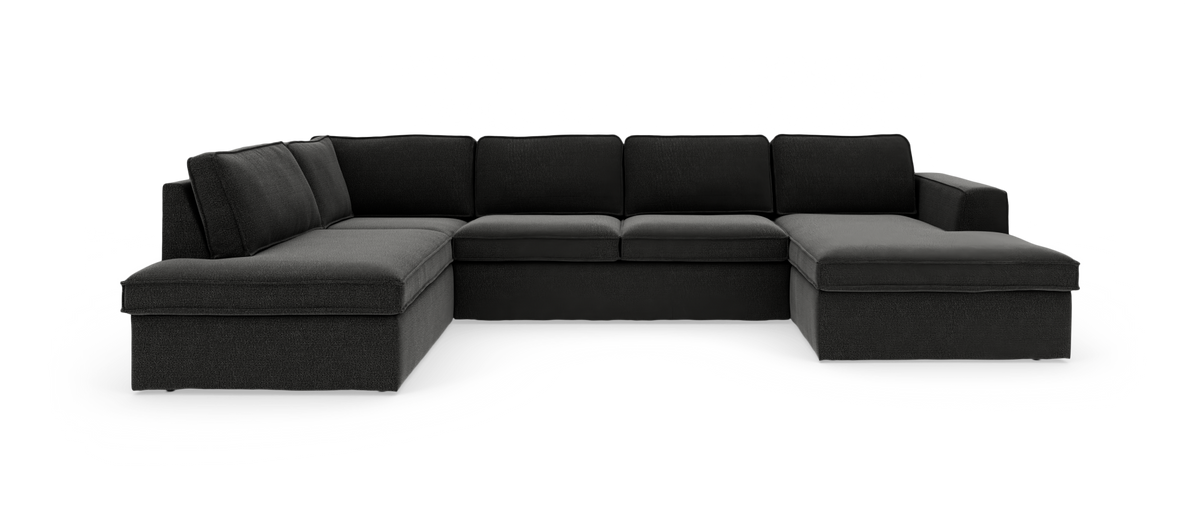 Mørkegrå U-formet modulsofa med chaiselong i begge ender, fritstående mod hvid baggrund.