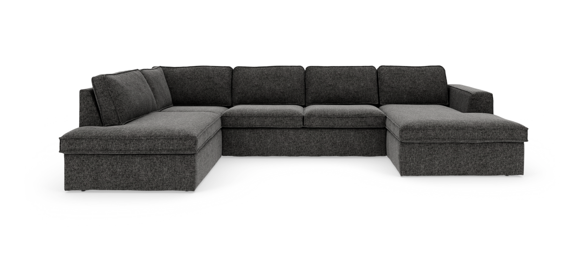 Mørkegrå modulsofa i U‑form med chaiselong til højre og divan til venstre.