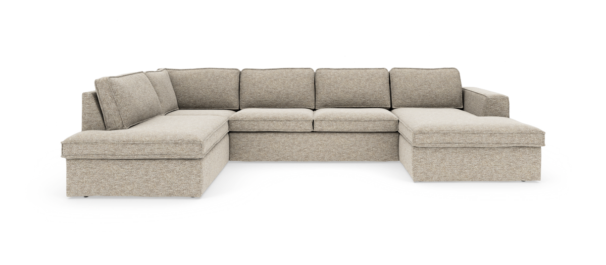Beige modulsofa i U‑form med chaiselong i begge ender, frilagt produktfoto.