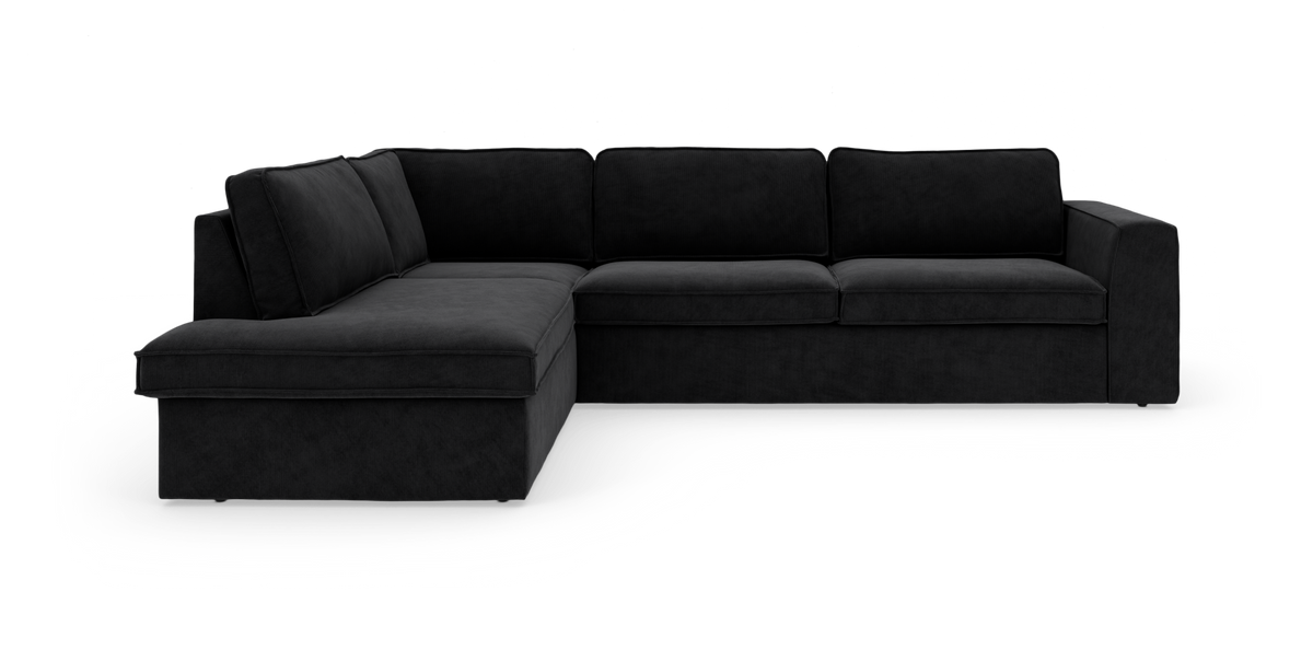 Sort L-formet modulsofa med chaiselong til venstre på hvid baggrund.
