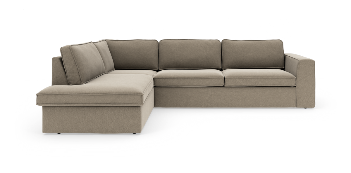 L-formet beige modulsofa med chaiselong til venstre, fritstående på hvid baggrund.