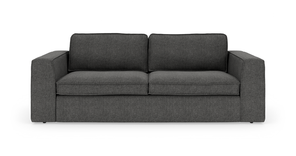 Mørkegrå sofa med brede armlæn og to sæde- og ryghynder, frilagt mod hvid baggrund.