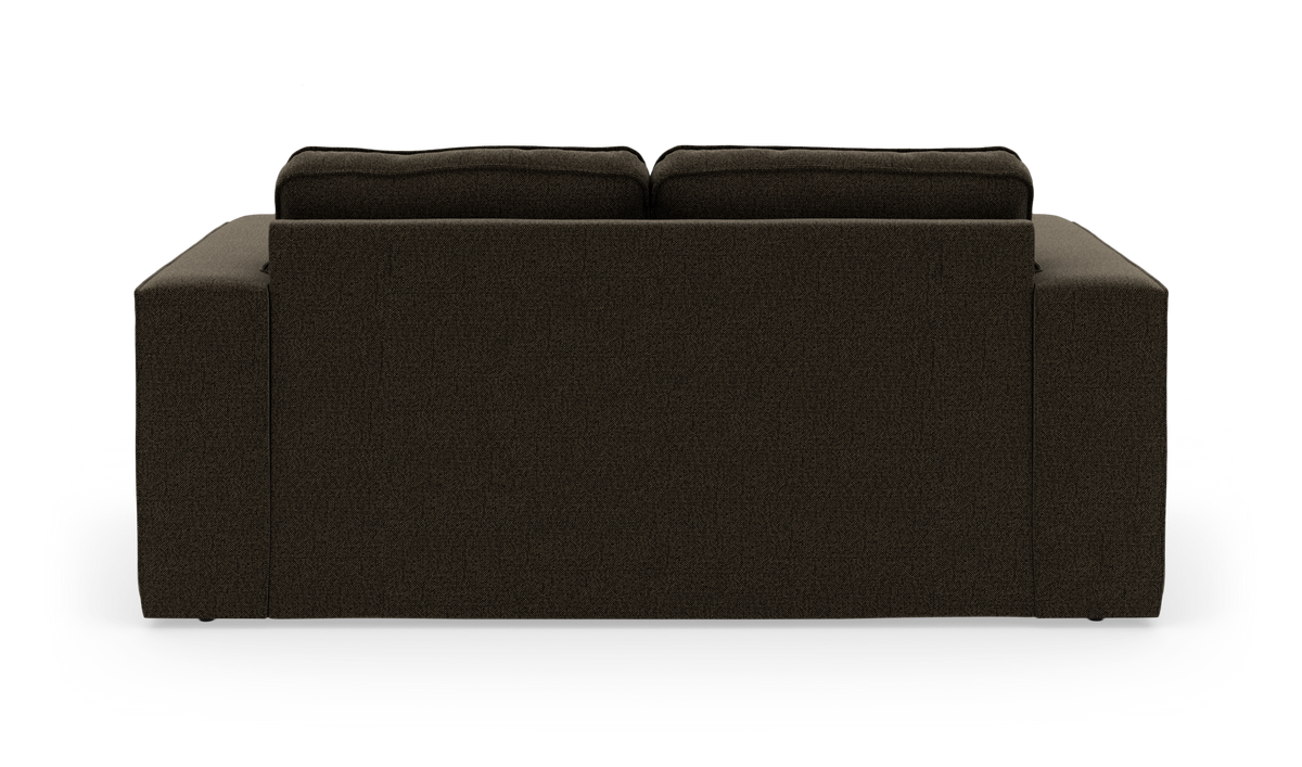 Mørkebrun sofa set bagfra med to ryghynder på hvid studiebaggrund.