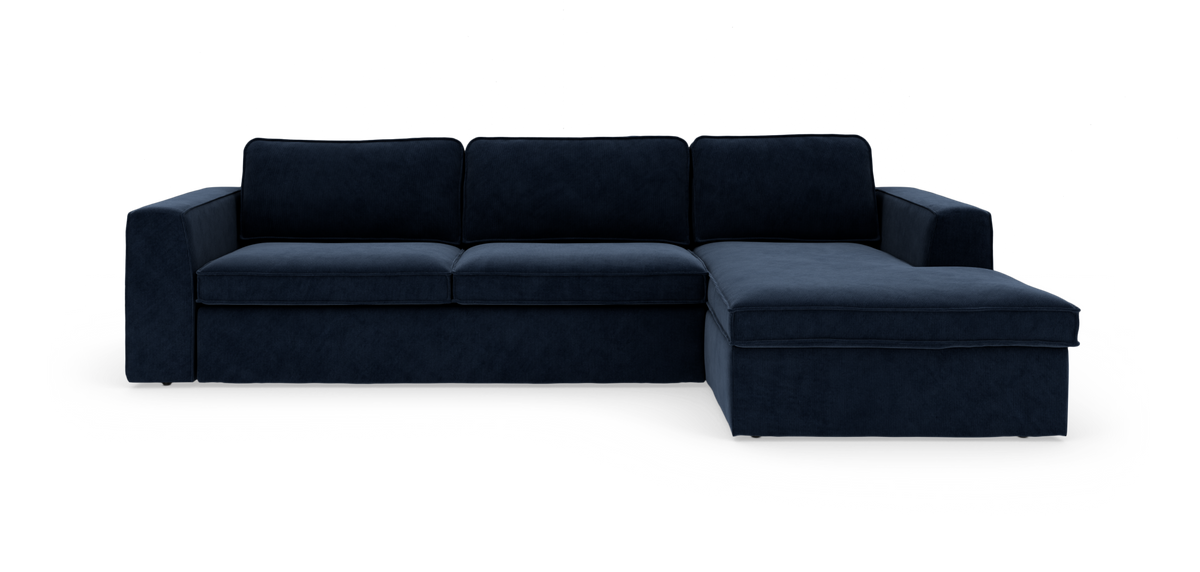 Mørkeblå modulsofa med chaiselong til højre i moderne stofdesign.
