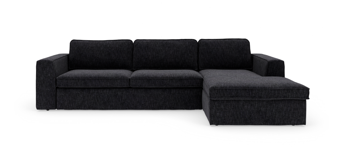 Mørkegrå hjørnesofa med chaiselong til højre, moderne og lav, frilagt på hvid baggrund.