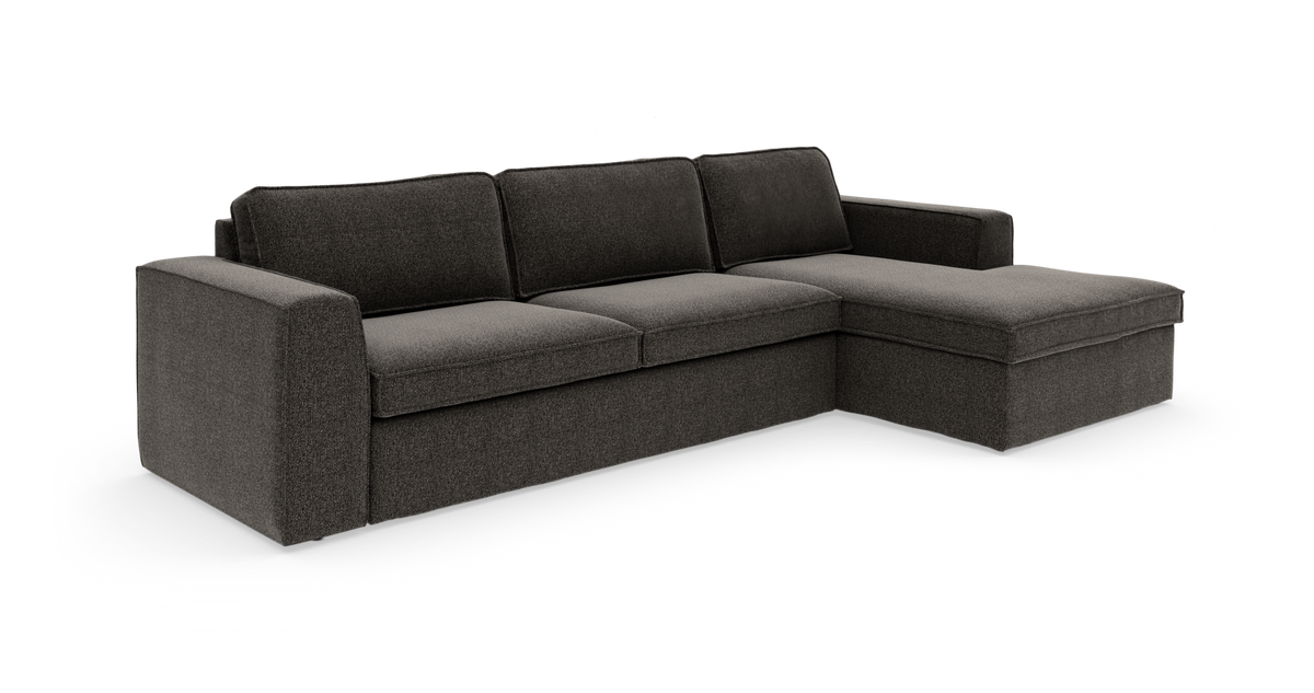 Mørkegrå hjørnesofa med højre chaiselong i stof, frilagt på hvid baggrund.