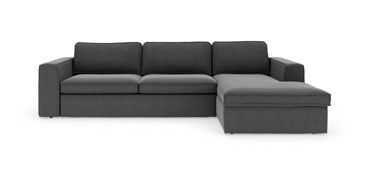 Mørkegrå hjørnesofa med chaiselong til højre, fritstående på hvid baggrund.