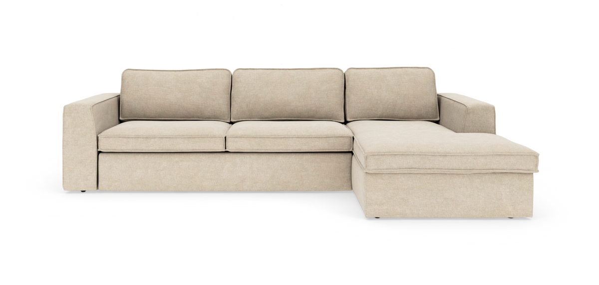 Beige modulsofa med højrevendt chaiselong, frontvisning på hvid baggrund.