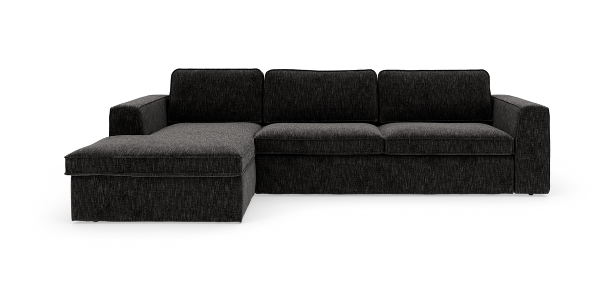 Mørkegrå hjørnesofa med venstrevendt chaiselong, lige ryg og brede armlæn på hvid baggrund.