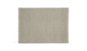 Beige rektangulært tæppe med subtilt vævet mønster og lys kant.