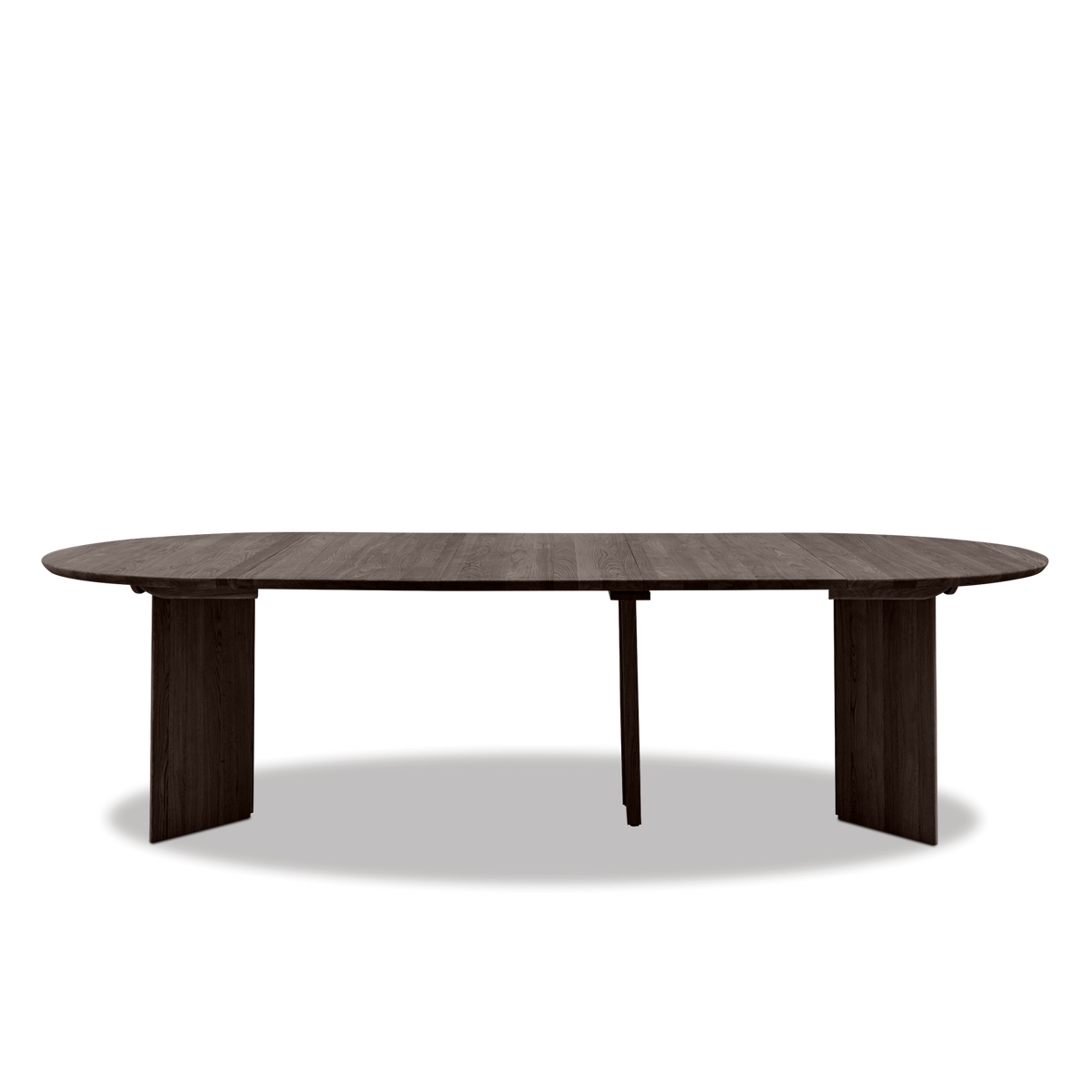Ovalt spisebord i mørk valnød med to pladestel og en midterstøtte, frilagt mod hvid baggrund.