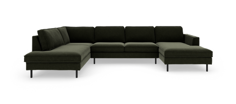Mørkegrøn U‑formet modulsofa med chaiselong i begge ender og slanke metalben, fritlagt på hvid baggrund.