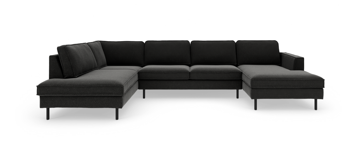 Stor mørkegrå hjørnesofa i tekstil med chaiselong på venstre og højre side, fritlagt produktbillede.