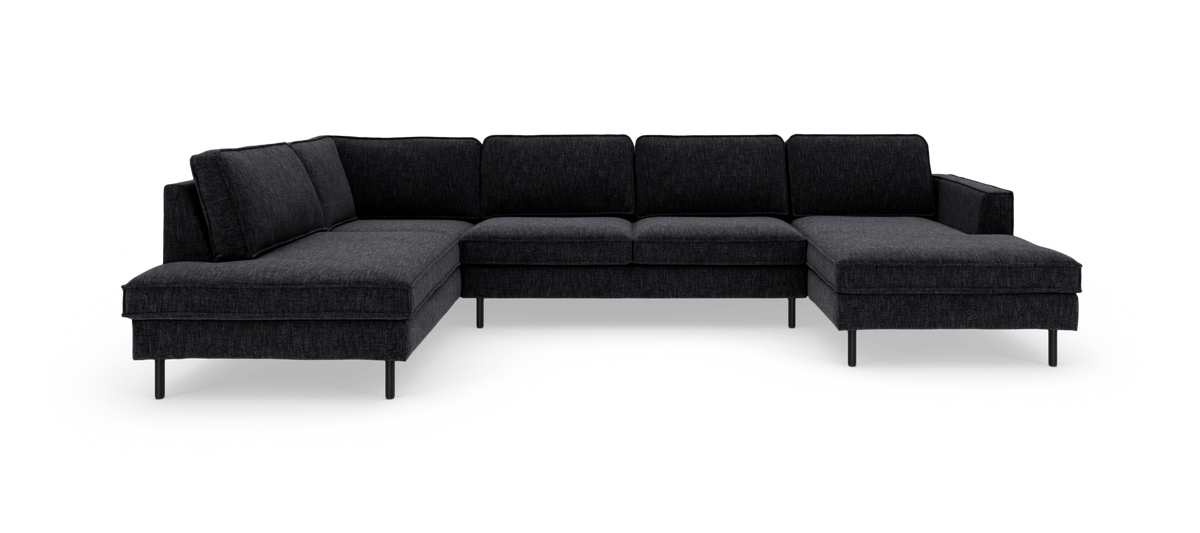 Mørkegrå U‑formet modulsofa med chaiselong i begge ender, fritstående på hvid baggrund.