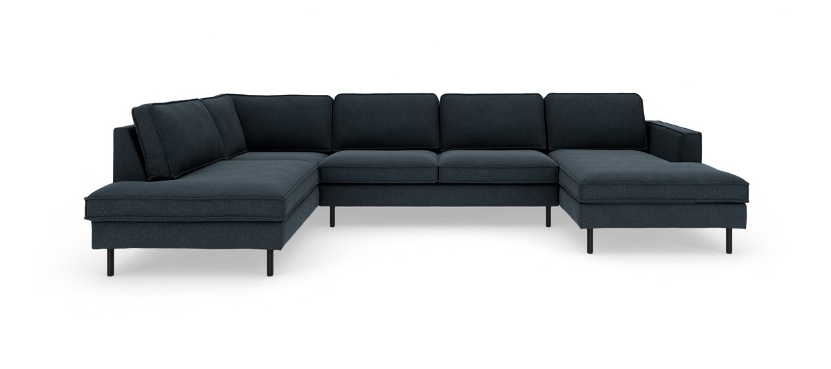 Mørkeblå U-formet modulsofa med chaiselonger i begge ender og slanke sorte ben.