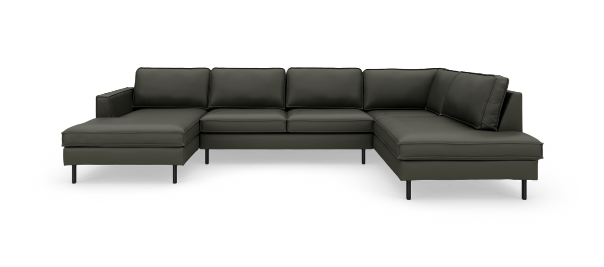 Modulær mørkegrøn U-formet hjørnesofa med chaiselonger i begge ender, frilagt mod hvid baggrund.