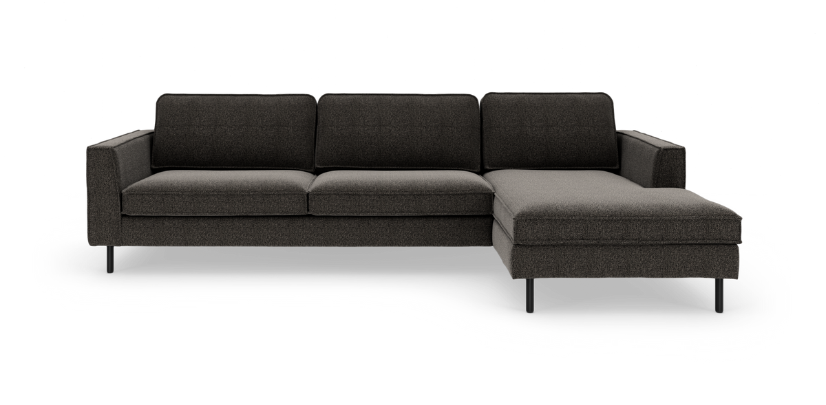 Mørkegrå hjørnesofa med chaiselong til højre, slanke ben og enkel, moderne stil.