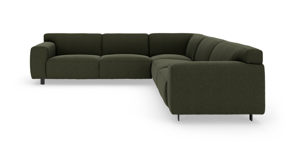 Mørkegrøn modulsofa i stof, L-formet med brede armlæn og metalben.