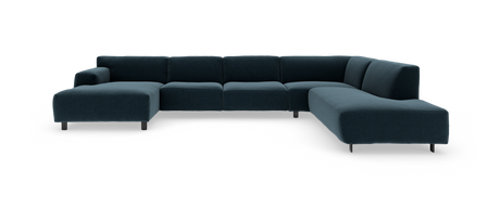 Stor U-formet modulsofa i mørk blå stof med chaiselong til venstre og rundet afslutning til højre, fotograferet mod hvid baggrund.