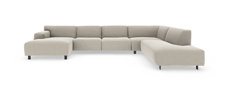 Modulær beige U‑formet hjørnesofa med chaiselong til venstre, fritstående på hvid baggrund.