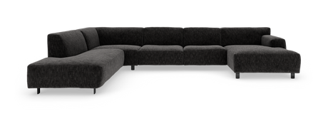 Mørkegrå modulhjørnesofa med chaiselong i begge ender og slanke metalben, vist i studie.