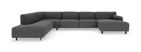 Mørkegrå modulsofa i U-form med lav ryg og slanke sorte ben, fotograferet lige for i studiemiljø.
