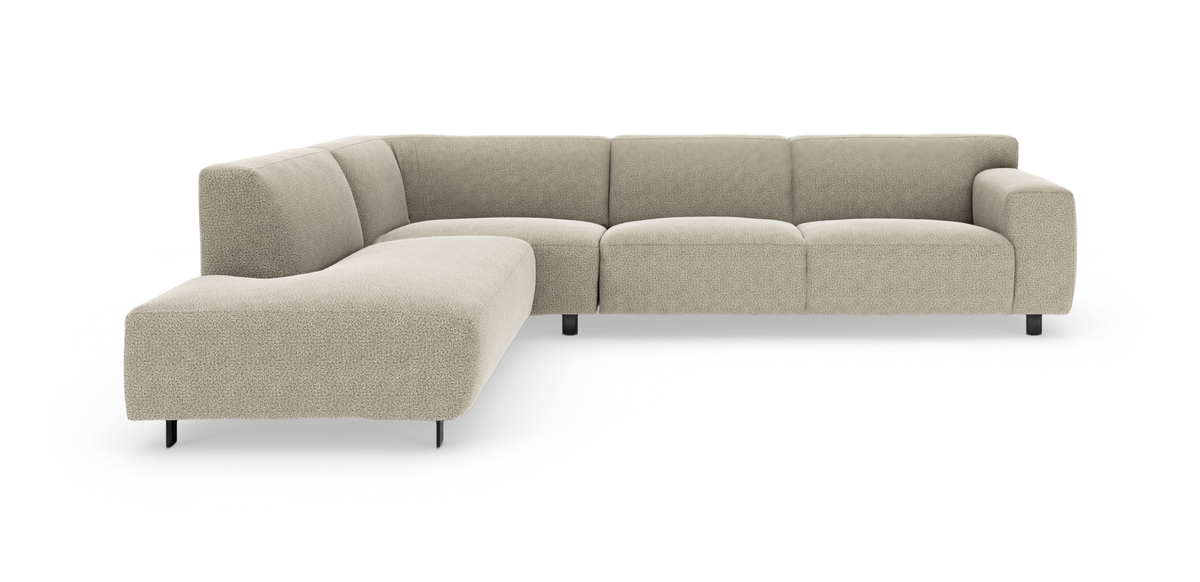 Beige L‑formet modulsofa med afrundede former og sorte metalben, frilagt på hvid baggrund.