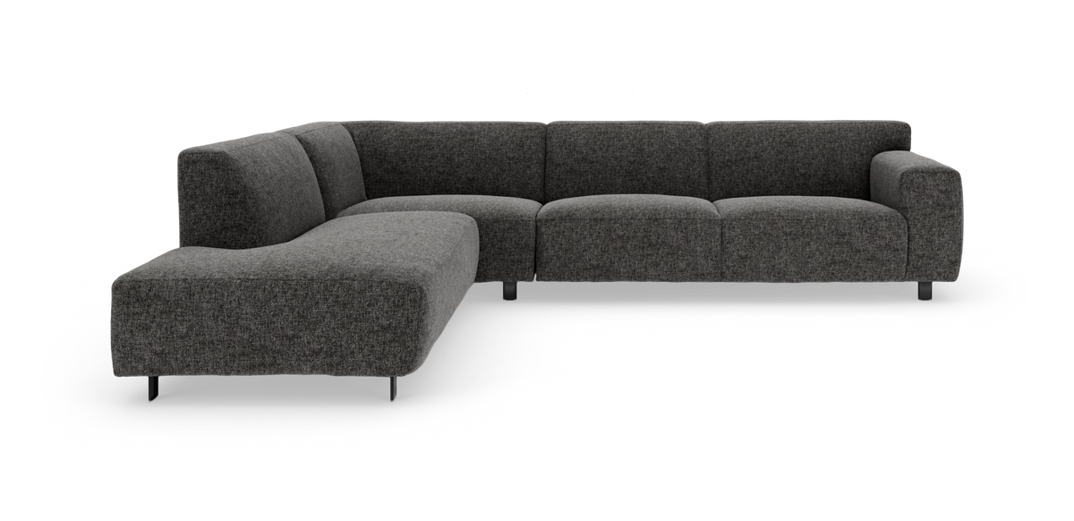 Mørkegrå L‑formet modulsofa i tekstil på hvid baggrund.