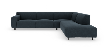 Mørkeblå L‑formet hjørnesofa med chaiselong til højre, frilagt på hvid baggrund.