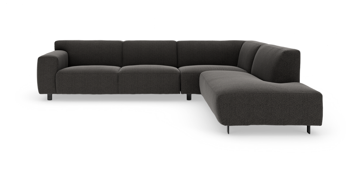 Mørkegrå L‑formet modulsofa på hvid baggrund.
