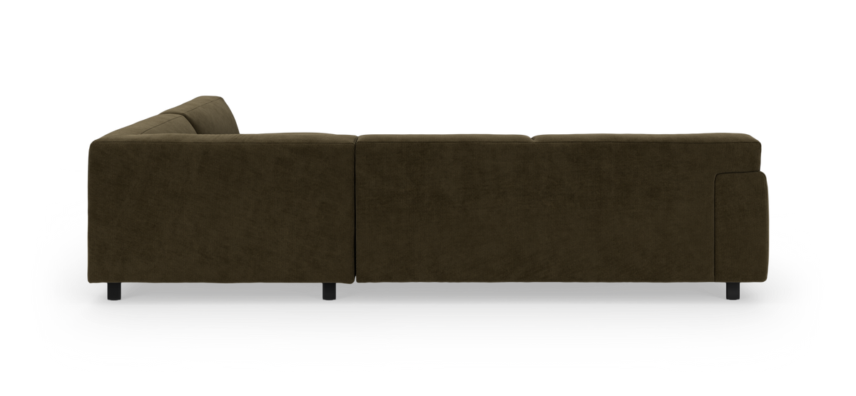 Modulsofa i mørkeolivengrøn fløjl set bagfra, frilagt på hvid baggrund.