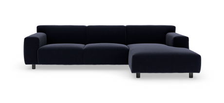 Mørkeblå modulsofa med højre chaiselong på hvid baggrund.