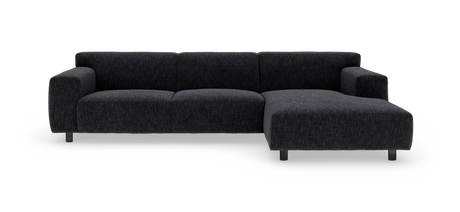 Mørkegrå modulær hjørnesofa med chaiselong til højre, frilagt på neutral baggrund.