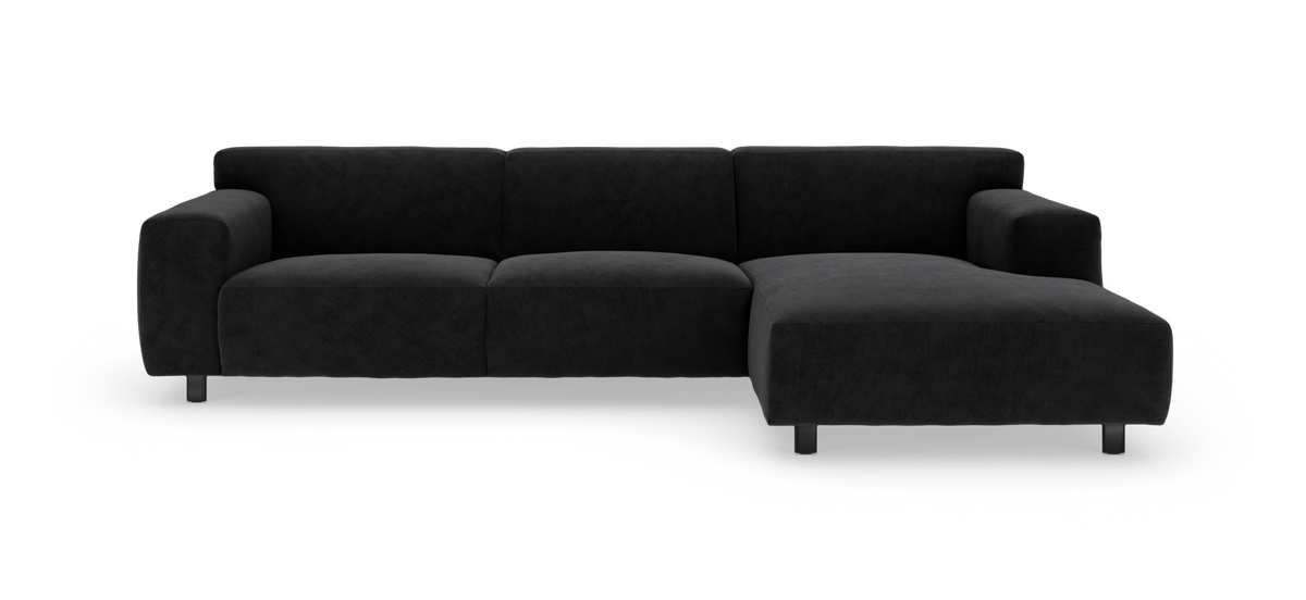 Mørkegrå modulsofa med chaiselong i højre side, frilagt på hvid baggrund.