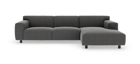 Mørkegrå modulsofa med højre chaiselong, fotograferet forfra i studie mod hvid baggrund.