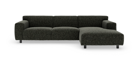 Mørkegrå modulsofa med chaiselong til højre, kraftige armlæn og metalben på hvid studiebaggrund.
