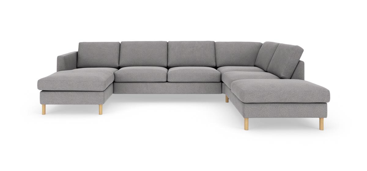 Grå U‑formet modulsofa med chaiselong i begge ender, træben, moderne design på hvid baggrund.