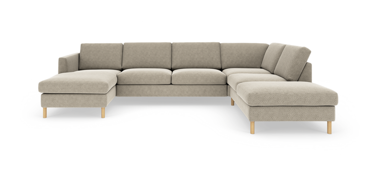 Beige modulsofa i L-form med træben, frilagt på hvid baggrund.