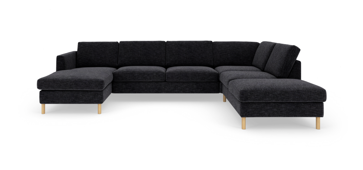 Mørkegrå modulsofa i U‑form med træben, chaiselong til venstre og divan til højre.