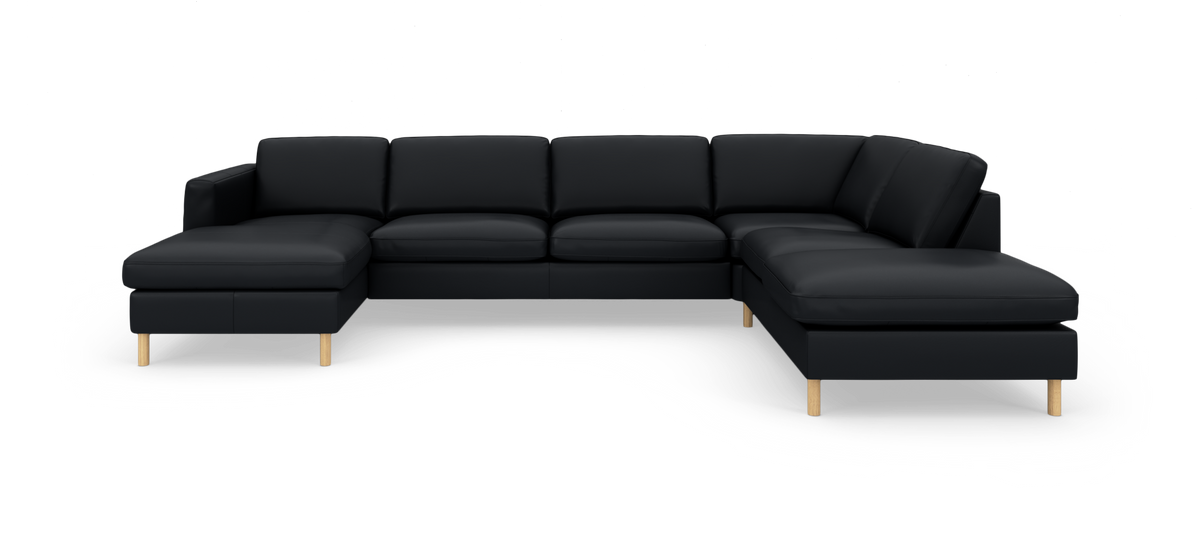 Sort U-formet modulsofa med chaiselong i begge ender og lyse træben.