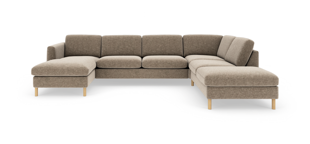 Beige U‑formet modulsofa med chaiselong i begge ender og træben, vist i studieopsætning.
