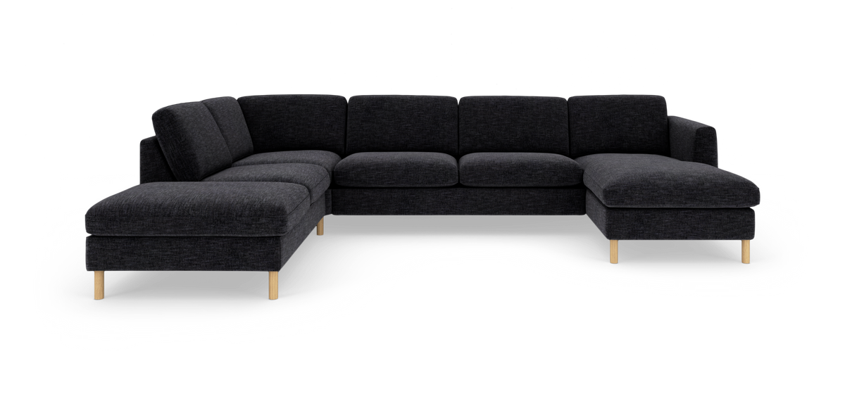 Mørkegrå U-formet modul-hjørnesofa med chaiselong i begge ender og lyse træben, frilagt på hvid baggrund.